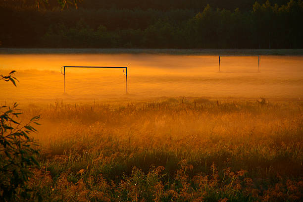 Football field in haze stock photo