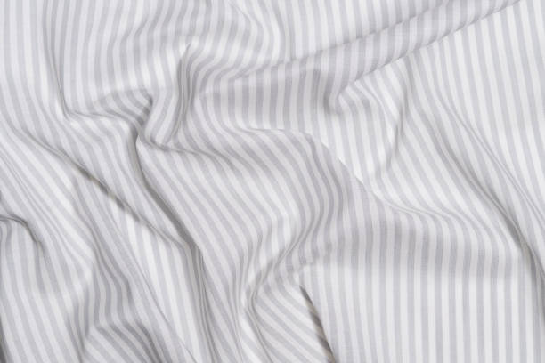istock crumpled gray and white striped fabric texture. material for sewing clothes. background for your mockup. 1778986842
