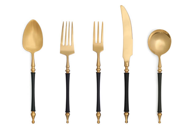 istock Stylish golden cutlery set on white background, top view 1779023509