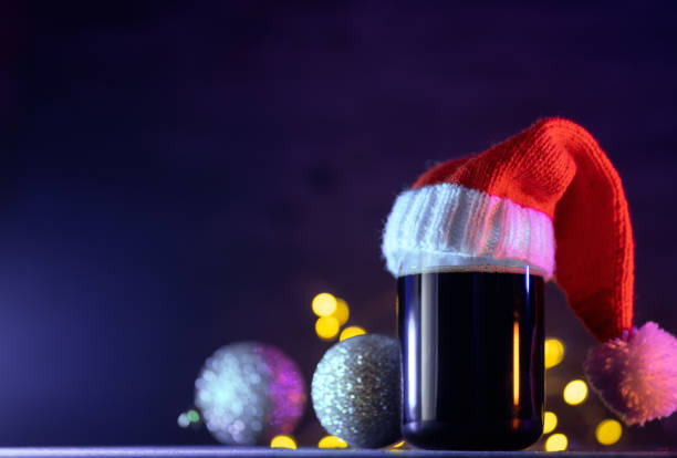 istock Craft dark beer in Santa hat , Christmas balls , copy space 1779058247