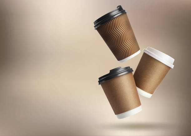 istock Collage with falling takeaway paper cups on light brown background. Space for text 1779063685