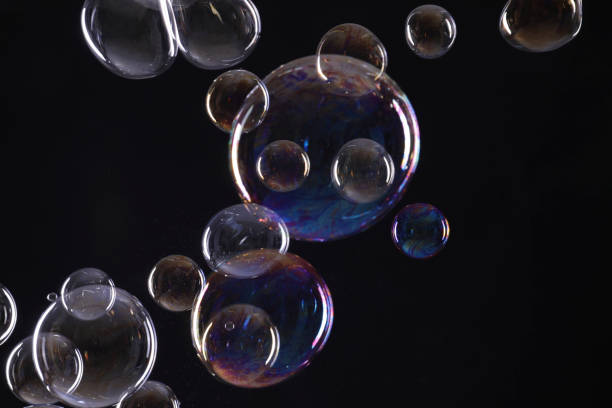 istock Many beautiful soap bubbles on black background 1779181099