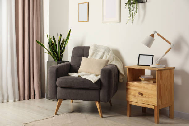 istock Cozy room interior with comfortable armchair, desk lamp and beautiful decor elements 1779191920