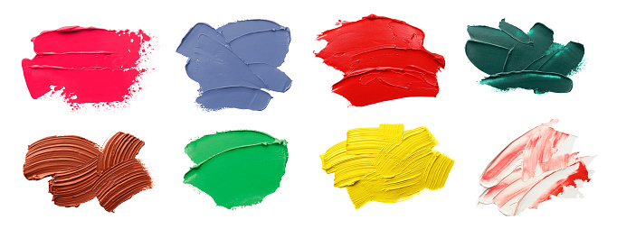 Set with strokes of colorful oil paints on white background, top view