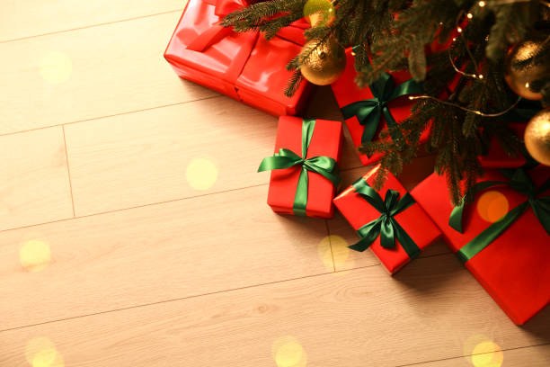 istock Many beautifully wrapped gift boxes under Christmas tree indoors, above view 1779227274