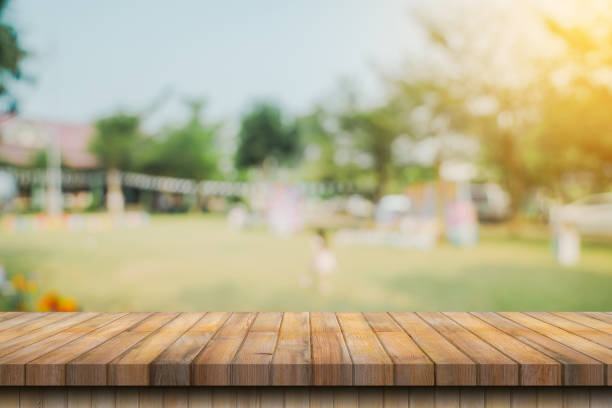 istock Empty wood table and blur garden with display montage for product 1779231971