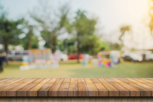 istock Empty wood table and blur garden with display montage for product 1779232227