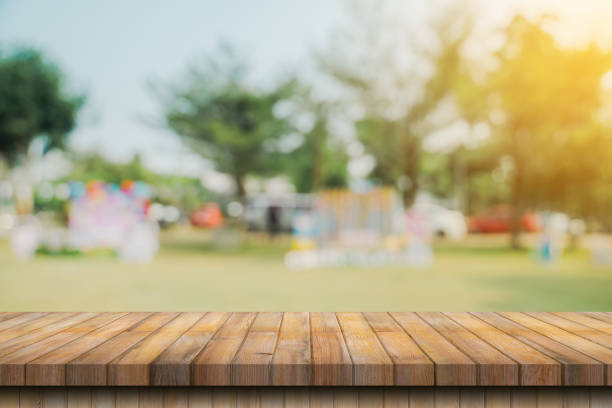 istock Empty wood table and blur garden with display montage for product 1779232243