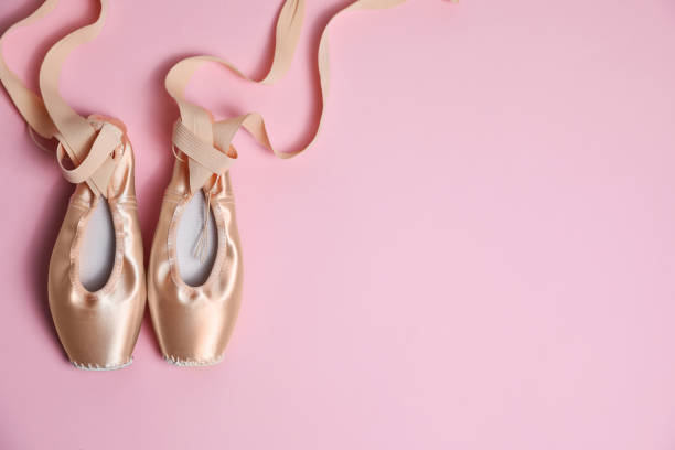 istock Ballet shoes. Elegant pointes on pink background, flat lay. Space for text 1779263841