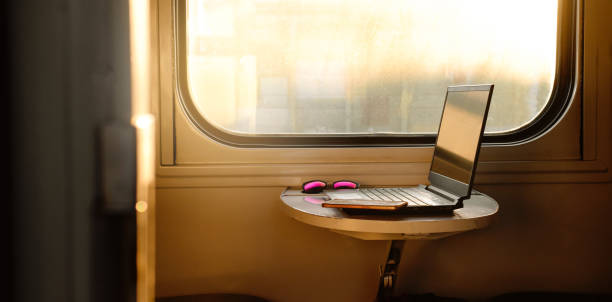 istock Laptop in train on the table by the window. Business trip 1779312423
