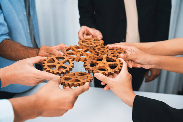 istock Business team joining cogwheel in circular together. Prudent 1779323764