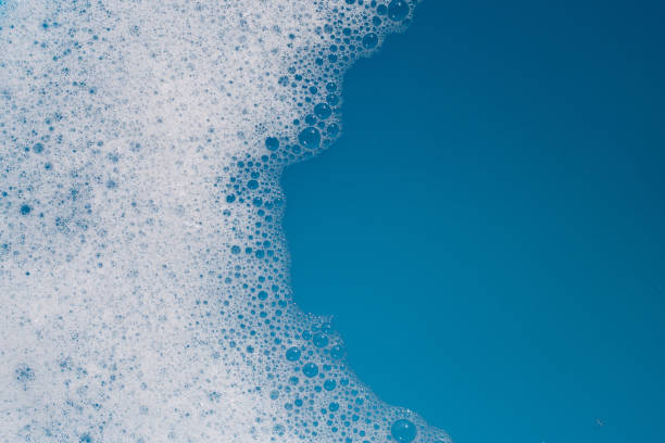 istock Detergent foam bubble on water. Blue background, Soap sud 1779324824