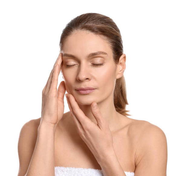 istock Woman massaging her face on white background 1779329288