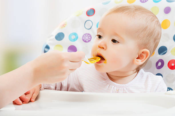 istock Mom feeds baby from  spoon 177938073