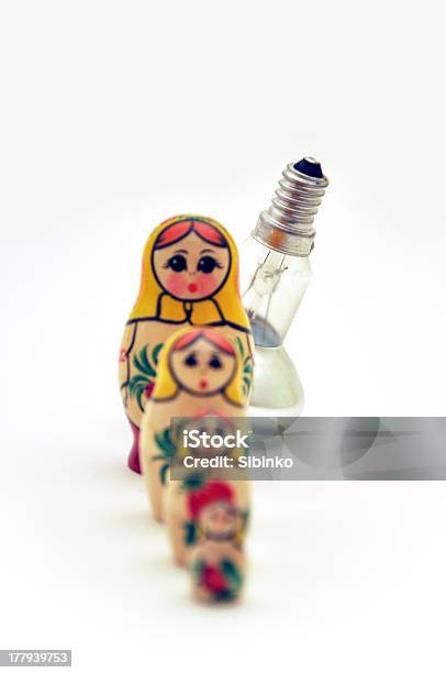 Four Russian Dolls And Bulb In A Line Stock Photo - Download Image Now - Art And Craft, Babushka, Concepts