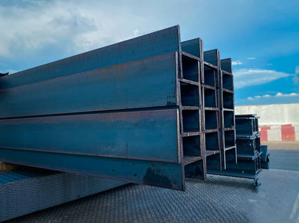 istock Steel beams production. Metal girders stack on project construction , steel h-beam, selective focus, Raw materials used in building construction. 1779447904
