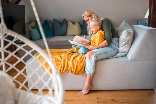 istock Mother and Son Relaxing with a Book 1779449041