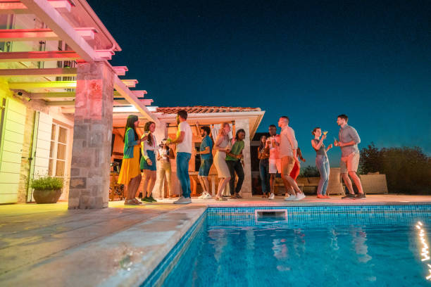 istock Diverse Friends Sipping Drinks at Poolside Hangout 1779449104