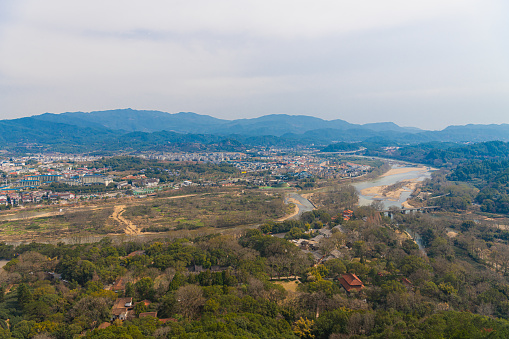 The view on the village by the river from Da Wang Shan Peak in Fujian, China. Wuyishan scenic area, copy space for text