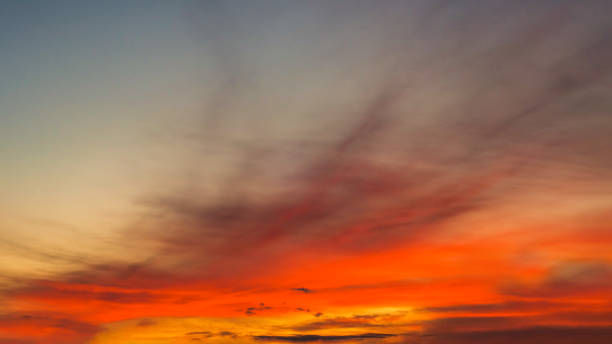 istock The sky before sunset, the sun painted the low clouds a bright orange 1779534004