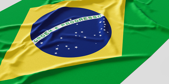 Flag of Brazil. Fabric textured Brazil flag isolated on white background. 3D illustration