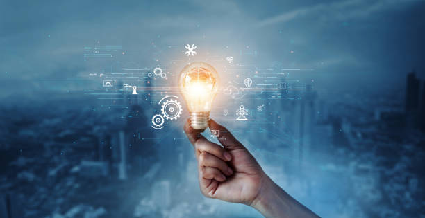 istock Creative, new ideas and innovation, Hand holding light bulb and smart brain inside and innovation icon network connection on dark blue city background, innovative technology in science and industrial. 1779591339