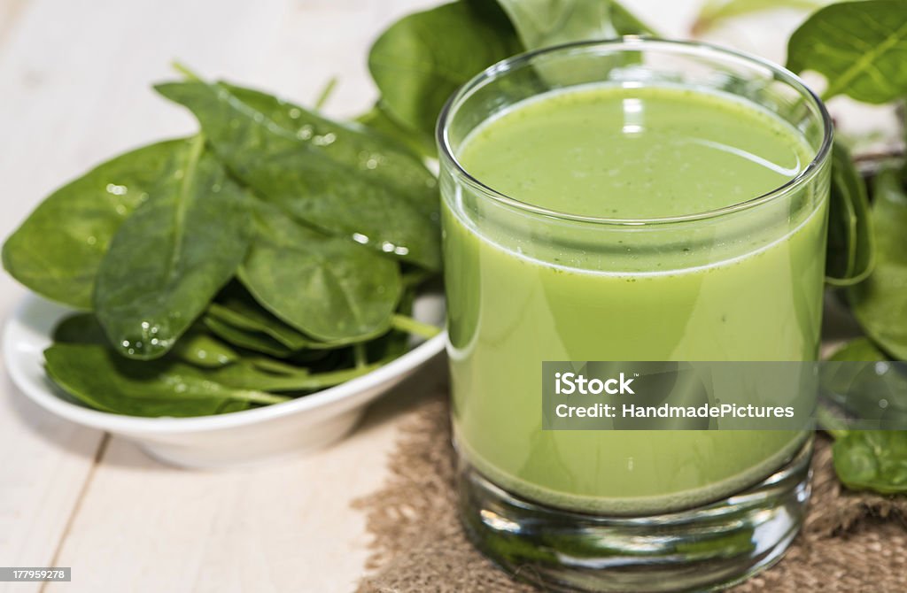 Healthy Spinach Juice Healthy Spinach Juice in a glass on wooden background Agriculture Stock Photo