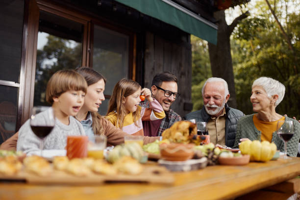 istock Cheerful extended family having fun during lunch on a terrace. 1779593506