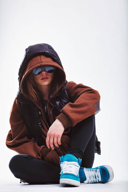 istock Seated youth hides face, appears thoughtful 1779623280