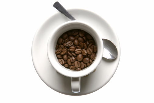 Cup of coffee beans on a white background.