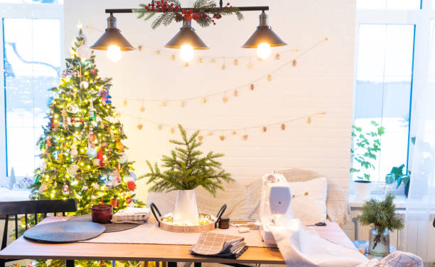 istock Sewing process on a sewing machine, a needle with a thread and a holder close-up stitch the white checkered fabric. Preparation for Christmas and new year, textiles for cozy in festive decor interior 1779637401
