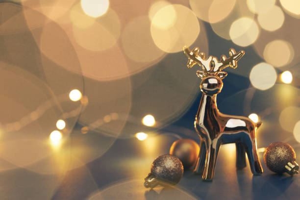 istock Christmas golden deer with decorations on dark background 1779663979