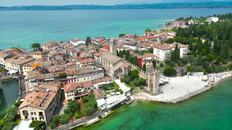 Aerial view of Sirmione on Lake Garda in Northern Italy, aerial view of the shoreline of Lake Garda, the largest Lake Garda in Italy, aerial view of  Sirmione town on Lake Garda in Italy, Aerial view Sirmione town