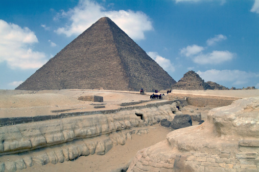Viewed from the back of the Sphinx is the Great Pyramid built, it is believed, as the tomb for the fourth dynasty Egyptian Pharaoh, Khufu