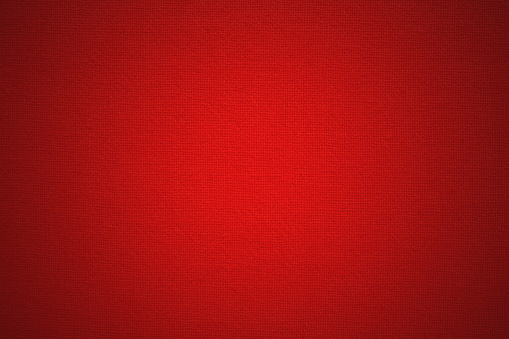 Dark red cotton fabric cloth texture for background, natural textile pattern.