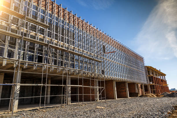 istock Extensive scaffolding providing platforms for work in progress on a new apartment block,Tall building under construction with scaffolds,Construction Site of New Building 1779698518