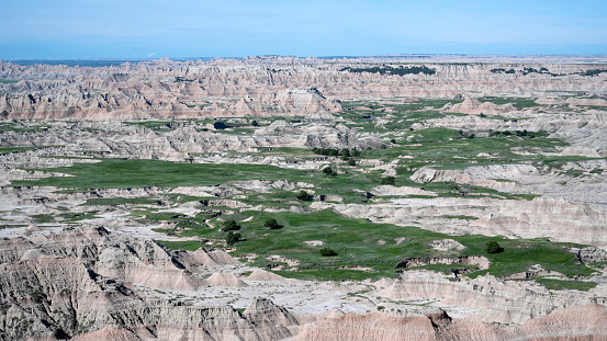 The Badlands from Pinnacles Overlook show eroded buttes with grassland (prairie) valleys. Badlands National Park, South Dakota, USA.