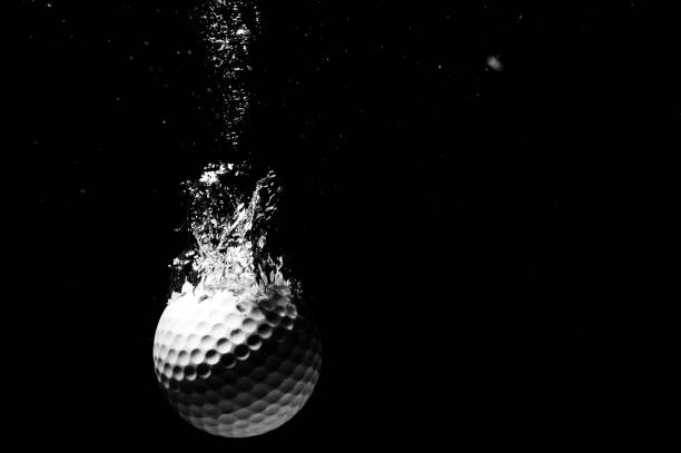 istock Golfball plunging into water in grayscale 1779720602
