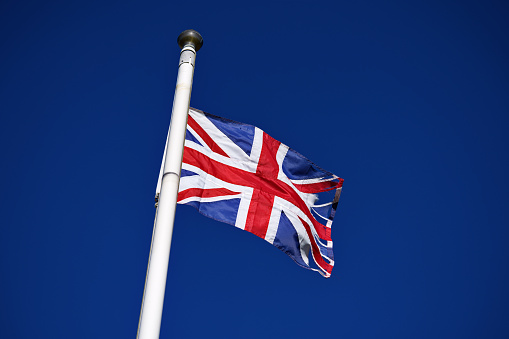 The United Kingdom national flag, flying Union Jack.