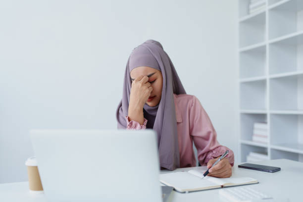 istock Muslim female employee working in office burnout. 1779733607