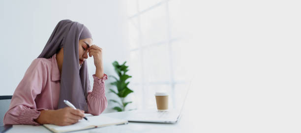 istock Muslim female employee working in office burnout. 1779733633