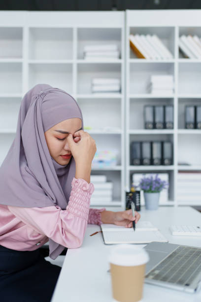 istock Muslim female employee working in office burnout. 1779734173