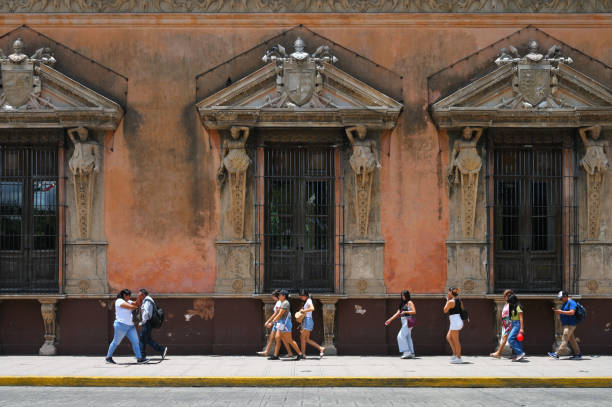 Merida, Mexico - July 20, 2023: Colorful colonial style buildings at street of Merida city old town, Mexico