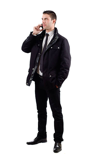 istock Man on a suit with jacket answering cellphone 177973751