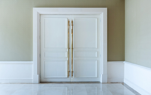 Closed white door in a luxury hotel