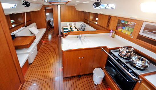 Motor yacht kitchen and living room inside cabin