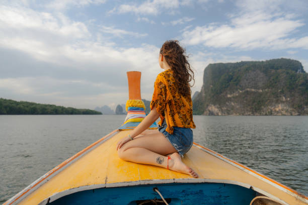 istock Woman exploring Phang Nga bay with boat 1779741234
