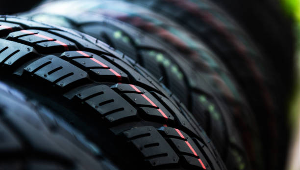 Group of new tires for sale in a line stock photo