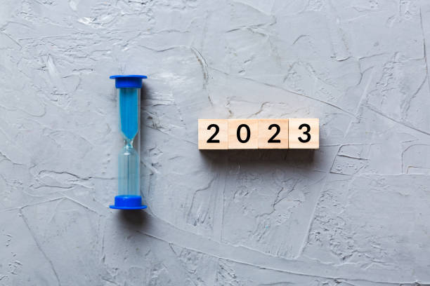 istock New Year 2023 sand timer. Resolution, time, plan, goal, motivation, reboot, countdown and New Year holiday concepts. Hourglass with number 2023 1779771688