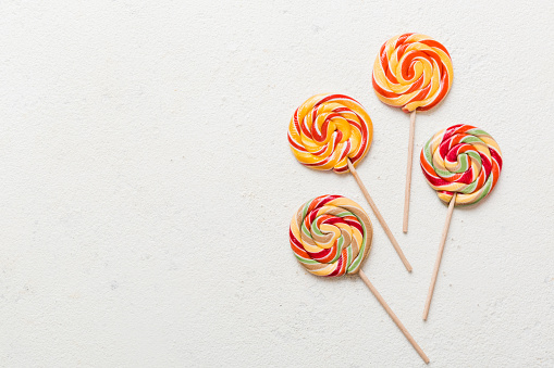 Set of colorful lollipops on colored background. Summer concept. Party Happy Birthday or Minimalist Concept.